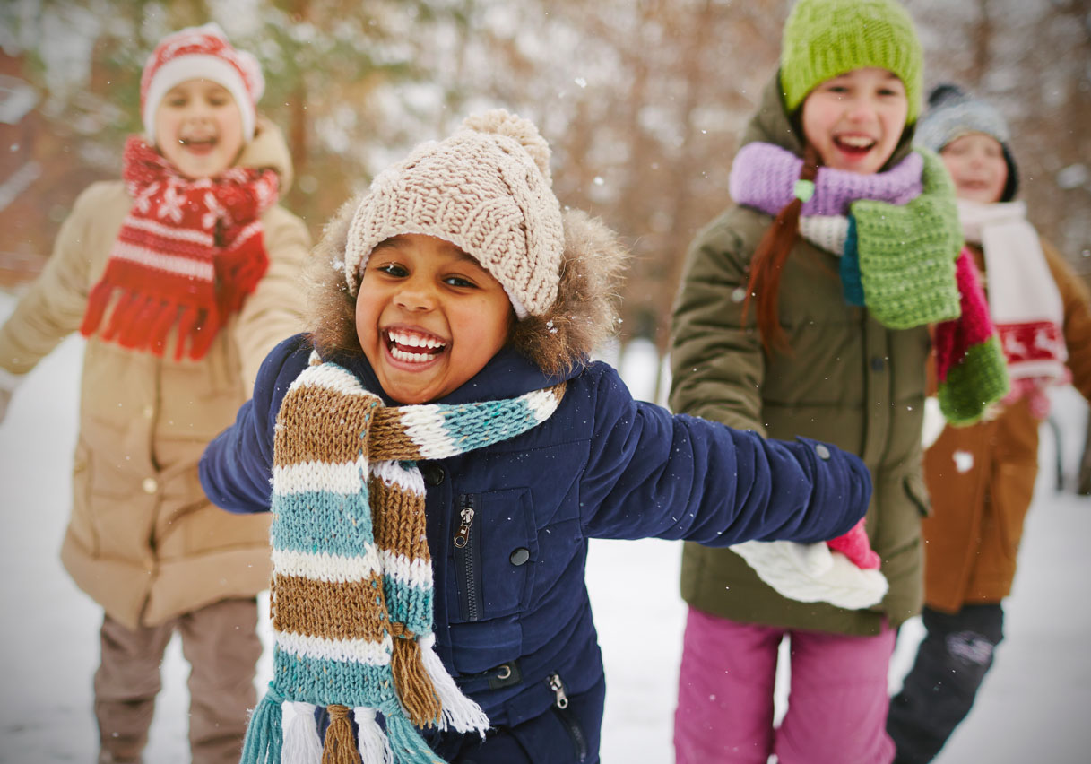 Child playing in the snow