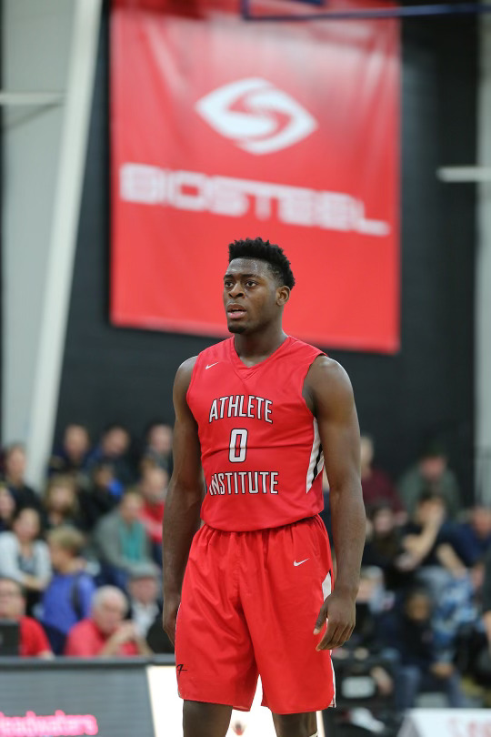 a basketball player in a red jersey