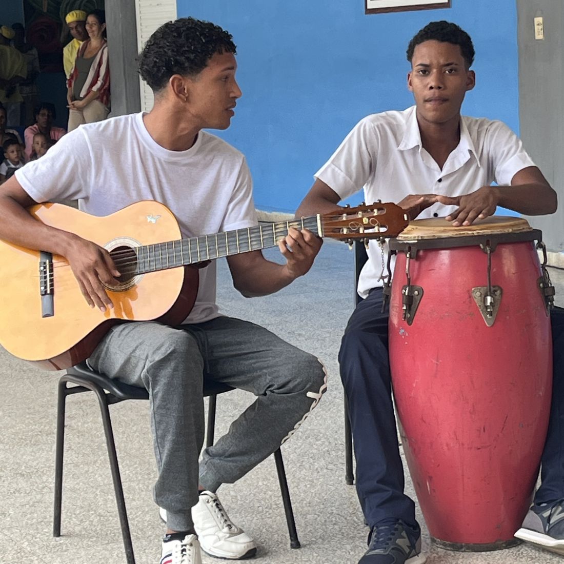 two boys play instruments