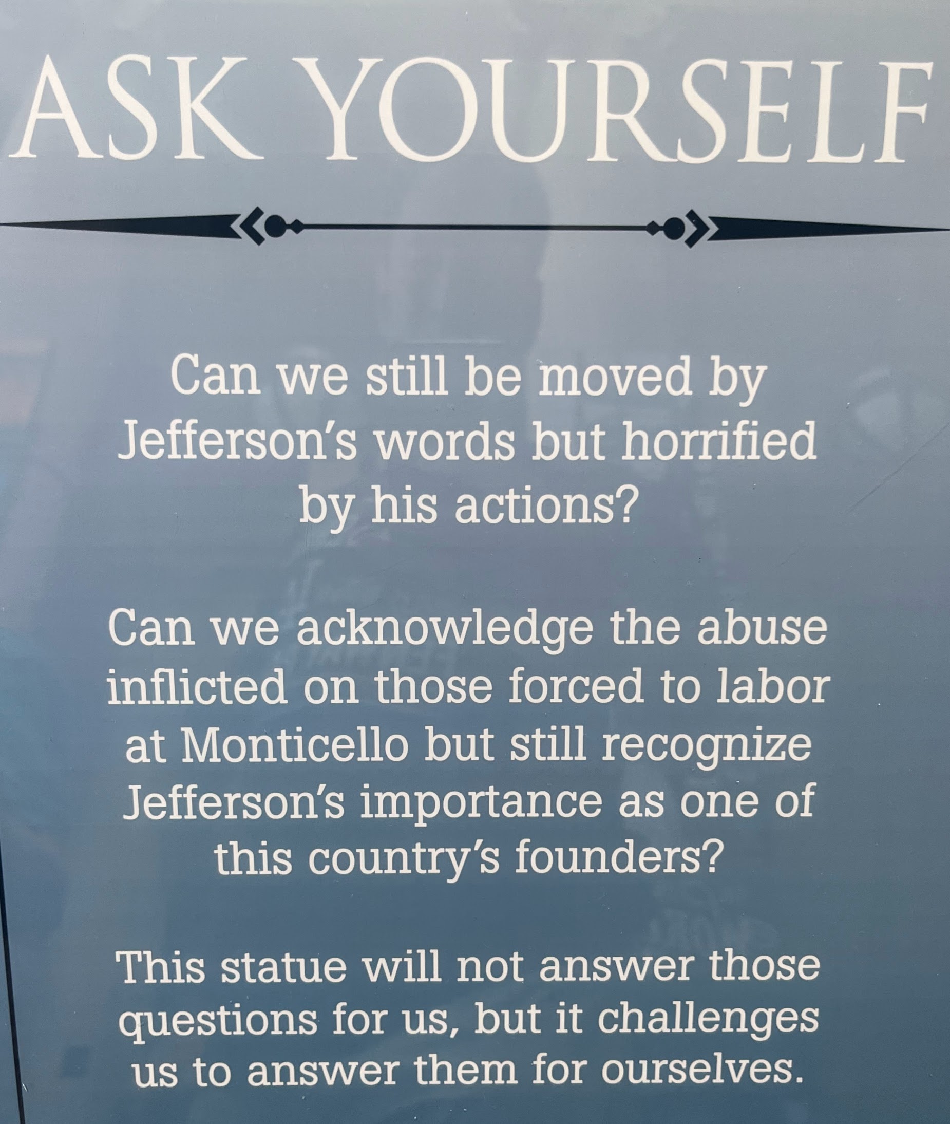 A sign on a statue